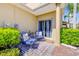 Cozy front patio featuring comfortable chairs and pleasant outdoor decor at 3621 Casello Dr, New Smyrna Beach, FL 32168
