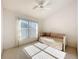 Well-lit bedroom with daybed, neutral carpet, and large window offering natural light at 3635 Kingswood Ct, Clermont, FL 34711