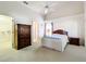 Vaulted ceiling bedroom with carpet, ceiling fan, closet, and neutral color palette at 3635 Kingswood Ct, Clermont, FL 34711