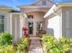Inviting front entrance with a charming bench, well-maintained landscaping, and a clear walkway at 3635 Kingswood Ct, Clermont, FL 34711