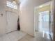 Bright foyer featuring tile flooring, a pendant light, and a view into adjoining rooms at 3635 Kingswood Ct, Clermont, FL 34711