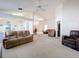 Expansive open-concept living area with high ceilings and ample seating space for entertaining at 3635 Kingswood Ct, Clermont, FL 34711