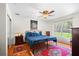 Cozy bedroom with a ceiling fan, natural light, and hardwood floors evokes comfort at 40610 Babb Rd, Umatilla, FL 32784