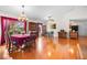 Open concept dining room with hardwood floors, large windows and views of the lake at 40610 Babb Rd, Umatilla, FL 32784