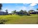A large backyard view of a house with a screened-in pool and a trampoline at 425 N Pine Meadow Dr, Debary, FL 32713