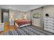 Bedroom featuring a neutral color palette, hardwood floors, and natural light at 425 N Pine Meadow Dr, Debary, FL 32713