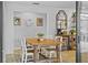 Inviting dining room with a wooden table, farmhouse decor, and lots of light at 425 N Pine Meadow Dr, Debary, FL 32713
