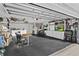 Organized garage featuring storage, a table, TV, and laundry hook ups at 425 N Pine Meadow Dr, Debary, FL 32713