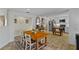 Spacious open kitchen featuring stainless steel appliances, a wooden dining table, and stylish decor at 425 N Pine Meadow Dr, Debary, FL 32713