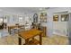 Open kitchen and dining area featuring a wooden dining table, stainless steel appliances, and bright lighting at 425 N Pine Meadow Dr, Debary, FL 32713
