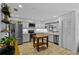 Bright kitchen featuring stainless steel appliances, light gray cabinetry, and a portable wooden island at 425 N Pine Meadow Dr, Debary, FL 32713