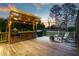 Inviting outdoor kitchen on a wooden deck, perfect for entertaining and enjoying the sunset at 425 N Pine Meadow Dr, Debary, FL 32713