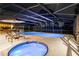 A relaxing pool with a screened enclosure, featuring a hot tub and outdoor bar area at 425 N Pine Meadow Dr, Debary, FL 32713
