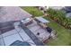 Aerial shot of a large wooden deck with a grilling area, wood storage, and string lights at 425 N Pine Meadow Dr, Debary, FL 32713