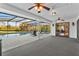 Screened outdoor pool area with lounge chairs, jacuzzi, and view of lush backyard at 425 N Pine Meadow Dr, Debary, FL 32713
