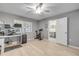 Spacious bedroom with light wood floors, a ceiling fan, and lots of natural light at 445 Bouchelle Dr # 104, New Smyrna Beach, FL 32169