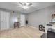 Neutral bedroom featuring wood-look floors, overhead fan, and white trim throughout at 445 Bouchelle Dr # 104, New Smyrna Beach, FL 32169