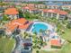 Aerial view of a large community pool and clubhouse, perfect for relaxation and social gatherings for residents at 445 Bouchelle Dr # 104, New Smyrna Beach, FL 32169