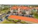 Stunning condo building features a bright orange tile roof and well-maintained landscaping at 445 Bouchelle Dr # 104, New Smyrna Beach, FL 32169