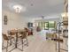 Inviting living area with neutral tones, comfortable seating, and a view of the screened lanai at 445 Bouchelle Dr # 104, New Smyrna Beach, FL 32169