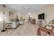 Spacious living space with tile flooring and ample seating for relaxation and entertainment at 445 Bouchelle Dr # 104, New Smyrna Beach, FL 32169