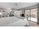 Bright main bedroom with a ceiling fan, light wood flooring, and access to the lanai at 445 Bouchelle Dr # 104, New Smyrna Beach, FL 32169