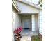 Inviting front entrance with a stylish blue door and decorative columns at 4618 Prairie Point, Kissimmee, FL 34746