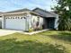 Charming single-story home with a well-manicured lawn and attached two-car garage at 4618 Prairie Point, Kissimmee, FL 34746
