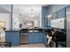 Updated kitchen with granite countertops, stainless steel appliances and blue cabinets at 4618 Prairie Point, Kissimmee, FL 34746
