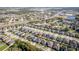 An aerial view of a residential area featuring a mix of single-Gathering homes, green spaces, and nearby amenities at 4862 Grand Vista Ln, St Cloud, FL 34771