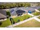 Aerial view of a home featuring solar panels and a fenced-in backyard with lush landscaping at 4862 Grand Vista Ln, St Cloud, FL 34771