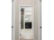 Bathroom view featuring a dark vanity, framed mirror, granite countertops, and glass enclosed shower at 4862 Grand Vista Ln, St Cloud, FL 34771