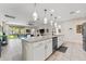 Stylish kitchen island with granite countertops, stainless steel appliances, and seamless transition to the living area at 4862 Grand Vista Ln, St Cloud, FL 34771