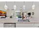 Kitchen island with stainless steel sink and view of the living room and backyard at 4862 Grand Vista Ln, St Cloud, FL 34771