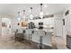 Well-appointed kitchen featuring an island with bar seating, stainless steel appliances, and ample cabinet space at 4862 Grand Vista Ln, St Cloud, FL 34771