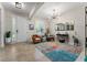 A cozy living room with tile floors, a vibrant rug, a modern chandelier, and stylish decor at 4862 Grand Vista Ln, St Cloud, FL 34771