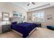 The primary bedroom features neutral walls, a tray ceiling, a ceiling fan, and a large window at 4862 Grand Vista Ln, St Cloud, FL 34771