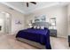 The primary bedroom features neutral walls, a tray ceiling, a ceiling fan, and a large window at 4862 Grand Vista Ln, St Cloud, FL 34771