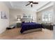 The primary bedroom features neutral walls, a tray ceiling, a ceiling fan, and a large window at 4862 Grand Vista Ln, St Cloud, FL 34771