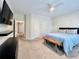 Cozy bedroom with large closets, neutral decor, and access to the hallway at 489 Water St # 489, Celebration, FL 34747
