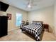Bright bedroom featuring plush carpet, ceiling fan, and a bike at 489 Water St # 489, Celebration, FL 34747