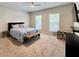 Comfortable bedroom with natural light, and minimalist decor at 489 Water St # 489, Celebration, FL 34747
