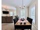 Spacious dining area adjacent to the living room with natural light at 489 Water St # 489, Celebration, FL 34747