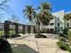 Beautiful building exterior featuring lush landscaping, palm trees, and architectural detail at 489 Water St # 489, Celebration, FL 34747