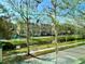 Exterior view featuring a canal and townhomes with mature trees at 489 Water St # 489, Celebration, FL 34747