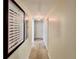 Hallway with neutral walls, carpet, and decorative artwork at 489 Water St # 489, Celebration, FL 34747