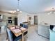 Open-concept living room and dining area with views into the kitchen at 489 Water St # 489, Celebration, FL 34747