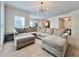 Bright living room features a large sectional sofa and contemporary lighting at 489 Water St # 489, Celebration, FL 34747