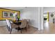Spacious dining room with plush chairs, dark table, and a yellow-themed accent wall at 5215 Ligonberry St, Lakeland, FL 33811