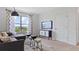 Relaxing living room with a gray sectional, TV, cabinet and a window with views at 5215 Ligonberry St, Lakeland, FL 33811